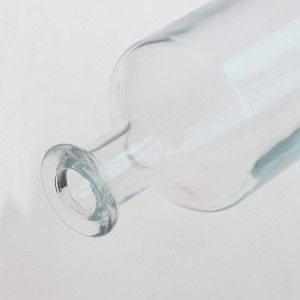 China 700ml Clear Round Shape Liquor Glass Bottle Manufacturer and Company | QLT