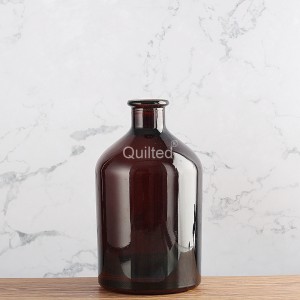 China 700 ml amber color liquor glass bottle with cork Manufacturer and Company | QLT