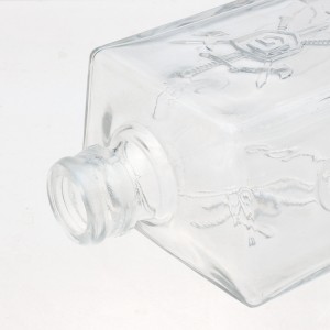 China 700ml fancy clear trapezoidal shape alcohol bottles Manufacturer and Company | QLT