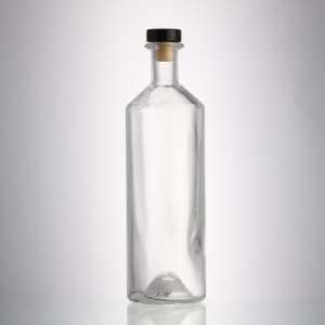 China 700 ml round liquor glass bottle with stopper cork Manufacturer and Company | QLT