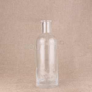 China 700ml embossed glass liquor bottle with cork Manufacturer and Company | QLT