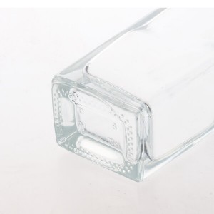 China 700ml clear trapeziod shape glass alcohol bottles Manufacturer and Company | QLT